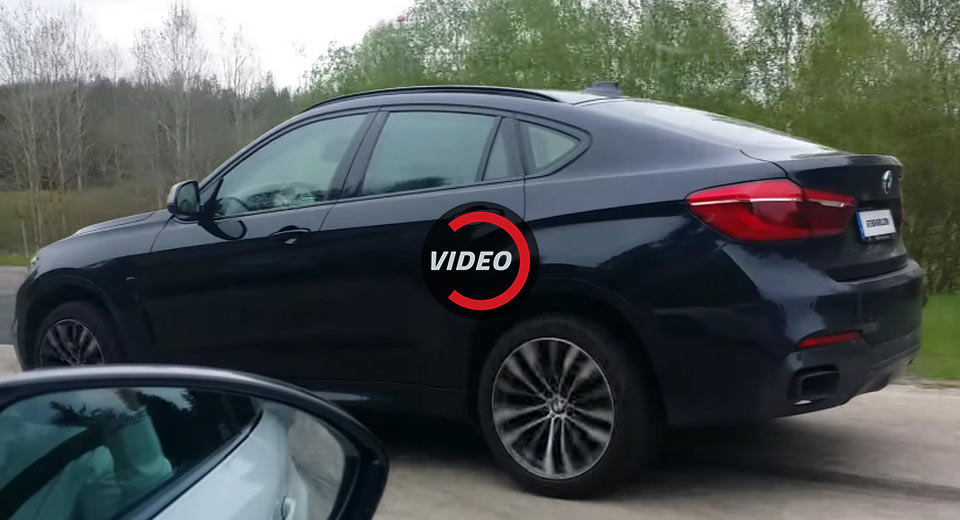 Drag Race: BMW 1M Coupe vs. BMW X6 M50d