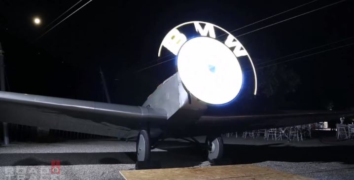 BWM displays its logo using radial lights on a plane